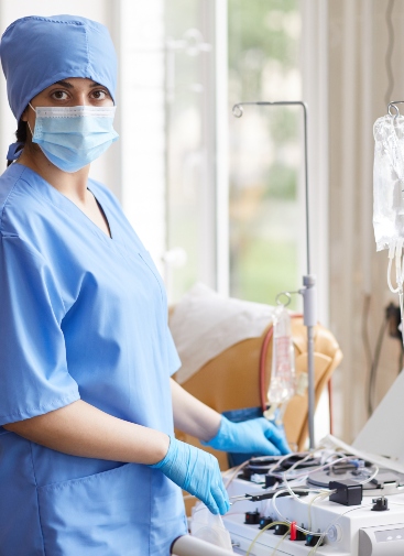 Portrait of nurse in mask and in uniform looking at camera while working with medical equipments for blood donation at hospital SSUCv3H4sIAAAAAAAACpySz27DIAzG75P2DhHnIiWQkLBXmXYwBlpUGqqEbJqqvvsgfyrOu+Gf8efPhsf7W1URBbND8lE9cpRi5/0yxwmiC2PC9Wnnkxm1mUpitIthcuBLqCDiZYSbSXBcvM/4uSbJHCEus5lzsx0hRHNOGht8SWyOPre4OhJrMlWkFCGngs2LWtmBNvF/VW6Hr2MaOJsRf1fDxSCT8Qa2QXaPRCiNiEJS01tOW1AtlRY1lU3XdcYqMSh5dCZiYP0gG0YtgqCt5D2FpgMKTDe1kZZpa1ZLmw9y/YlmupV7g0W7UKzsOyD4fIEXNu+TQzeei7IQL+sTHmUYljFOeb7XWogP4Q7K5/ezSdMc/ALznK7rgxeNMH2YcCv6jCGu29lViU7PnMOGs5Z1kg2M81ryru/3C9vXuLiks9o5hFKMV6fL0V12QJDVskdVU7Cipa2tBVWyZ2nz2A1cDFZqkVb4/AMAAP//AwDIfBou5AIAAA==